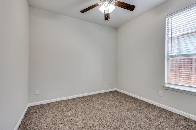 carpeted spare room with ceiling fan and a wealth of natural light