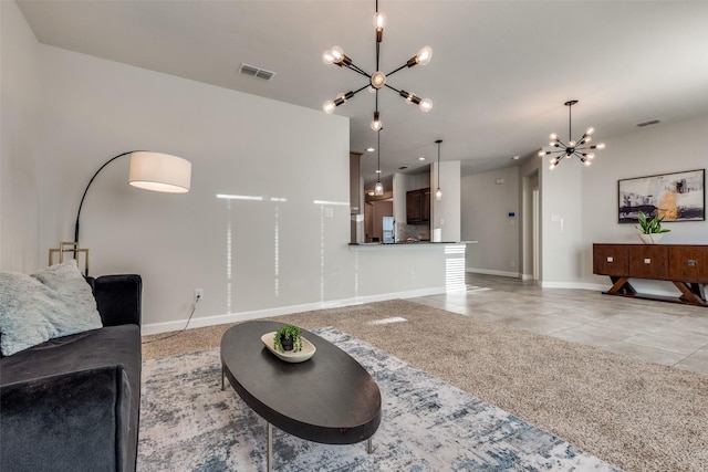 living room with light tile patterned floors and a chandelier