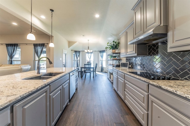 kitchen with pendant lighting, sink, dishwasher, dark hardwood / wood-style floors, and tasteful backsplash