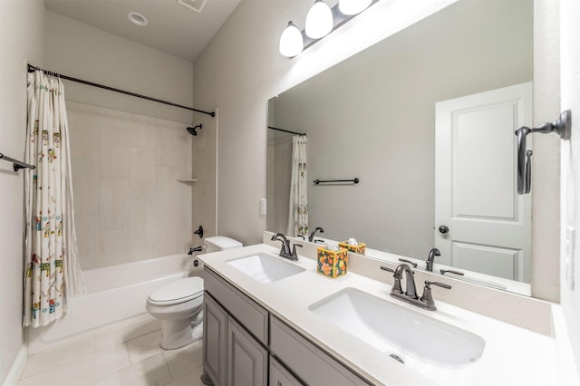 full bathroom featuring shower / bathtub combination with curtain, vanity, tile patterned floors, and toilet