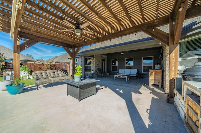 view of patio featuring area for grilling, a pergola, an outdoor hangout area, and ceiling fan