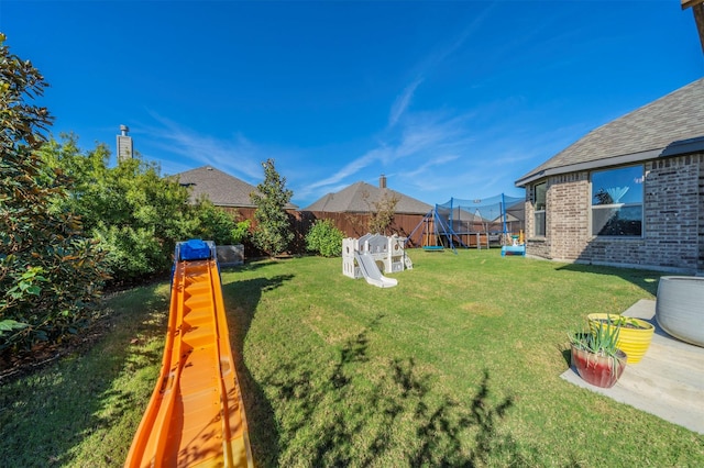 view of yard featuring a trampoline