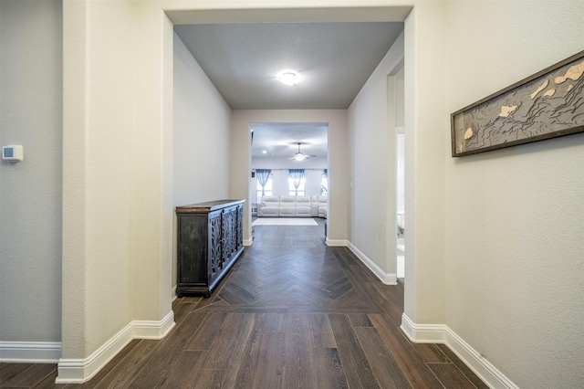 hallway with dark wood-type flooring