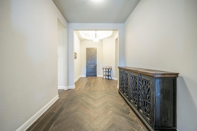 hallway with parquet flooring