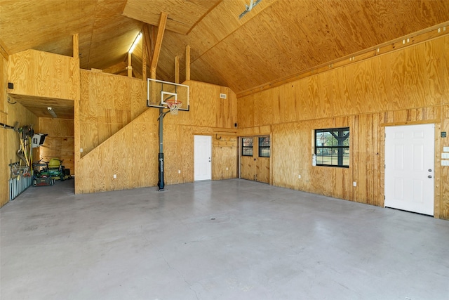 garage featuring wood walls and wooden ceiling