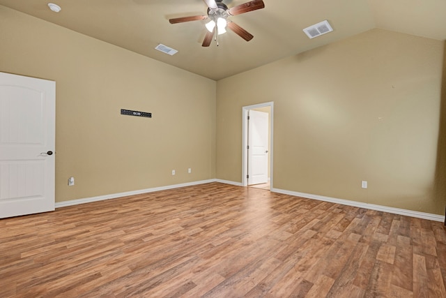 unfurnished room featuring light hardwood / wood-style flooring, ceiling fan, and lofted ceiling