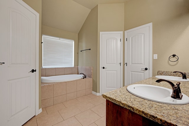 bathroom featuring tile patterned flooring, vanity, a relaxing tiled tub, and lofted ceiling