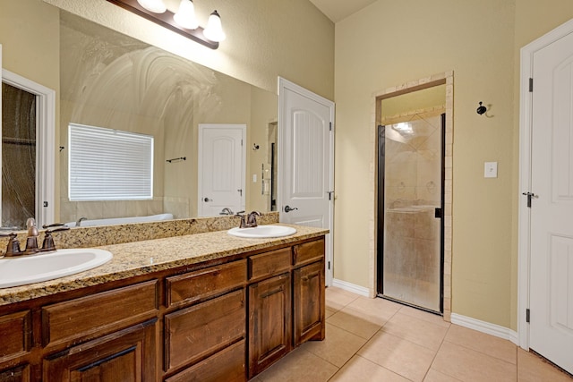 bathroom featuring tile patterned floors, vanity, and an enclosed shower