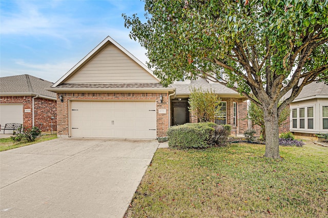 view of front of property with a garage and a front yard