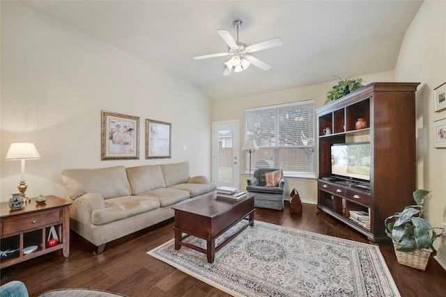 living room with dark wood-type flooring, vaulted ceiling, and ceiling fan