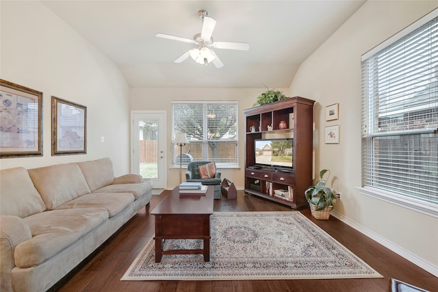 living room with dark hardwood / wood-style floors, ceiling fan, and lofted ceiling