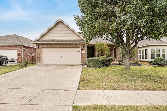 view of front of property featuring a garage and a front yard