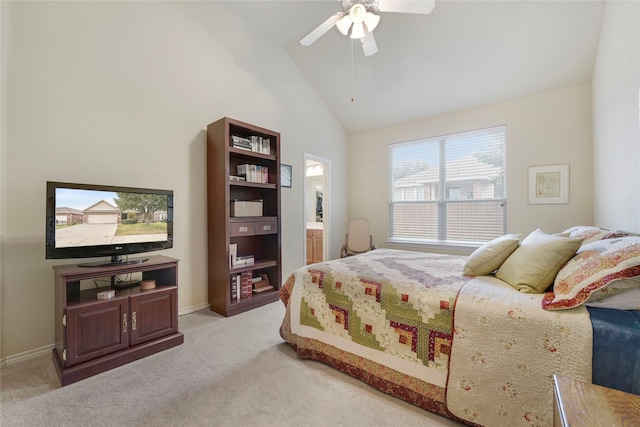 carpeted bedroom with ceiling fan and high vaulted ceiling