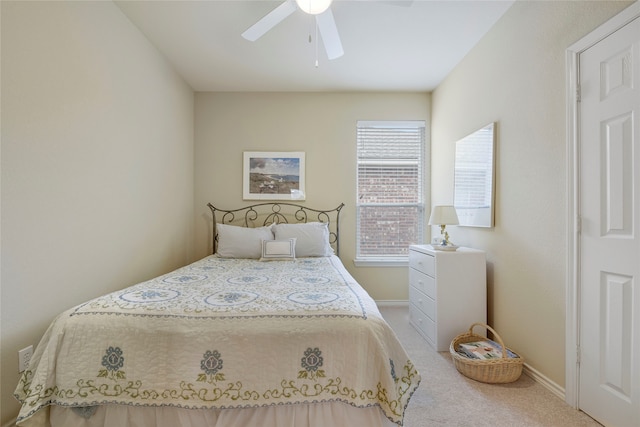 bedroom featuring ceiling fan and carpet