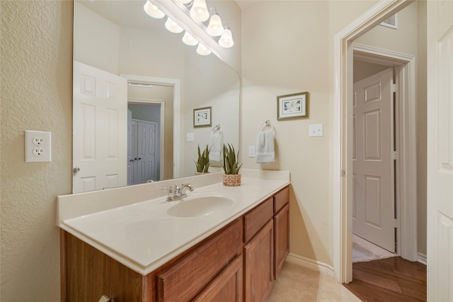 bathroom featuring vanity and wood-type flooring