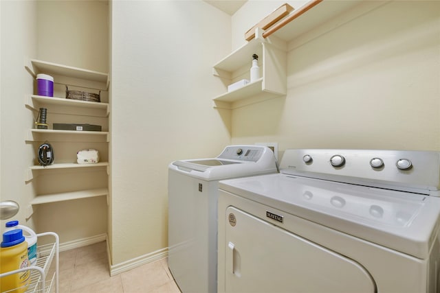 washroom with light tile patterned flooring and independent washer and dryer