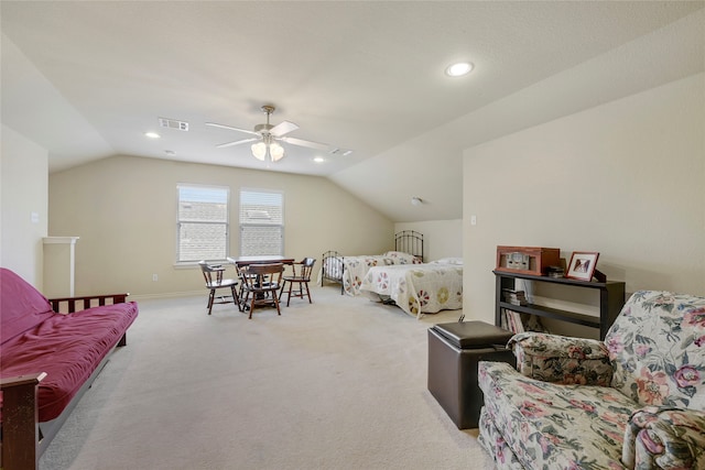 carpeted bedroom featuring vaulted ceiling and ceiling fan