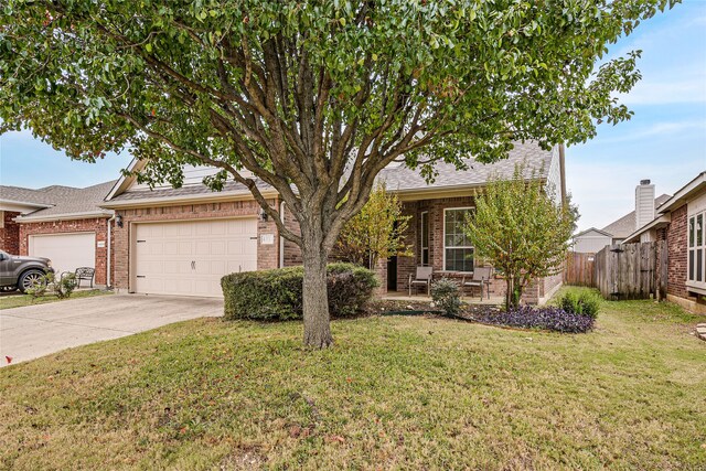 view of front of home featuring a garage and a front lawn