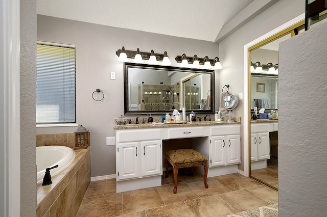 bathroom with plus walk in shower and vanity