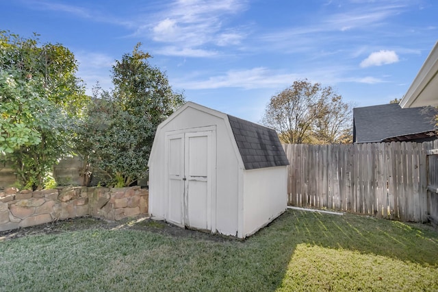 view of outbuilding with a yard