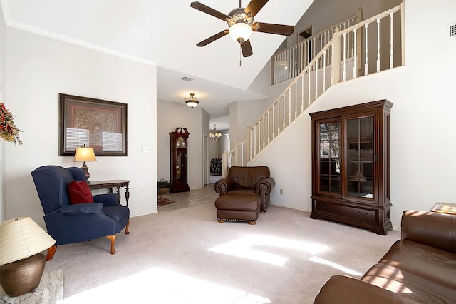 living room with light carpet, ceiling fan with notable chandelier, and lofted ceiling