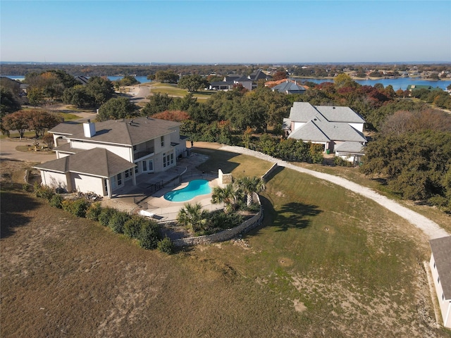 birds eye view of property featuring a water view and a residential view