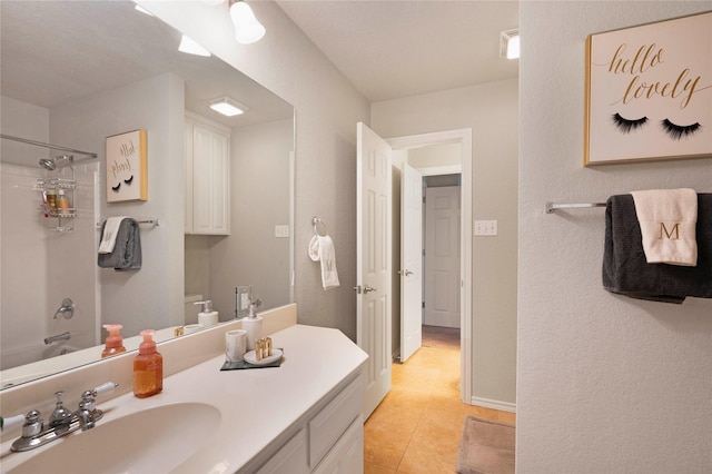 full bathroom with toilet, tile patterned flooring, vanity, and washtub / shower combination