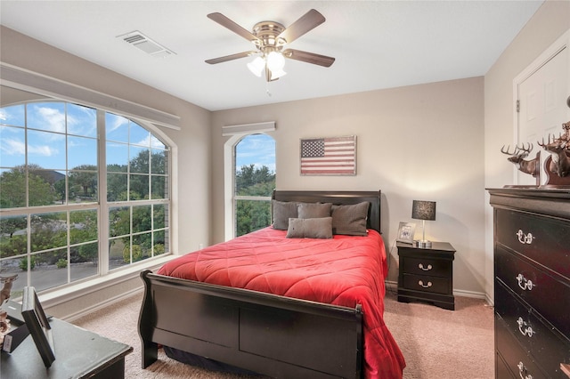 bedroom featuring ceiling fan and light colored carpet