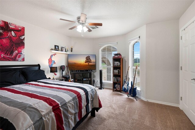 bedroom with ceiling fan and carpet floors