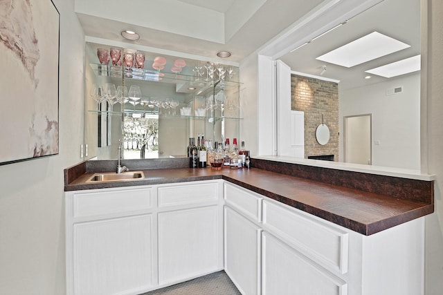 bathroom with vanity and a fireplace