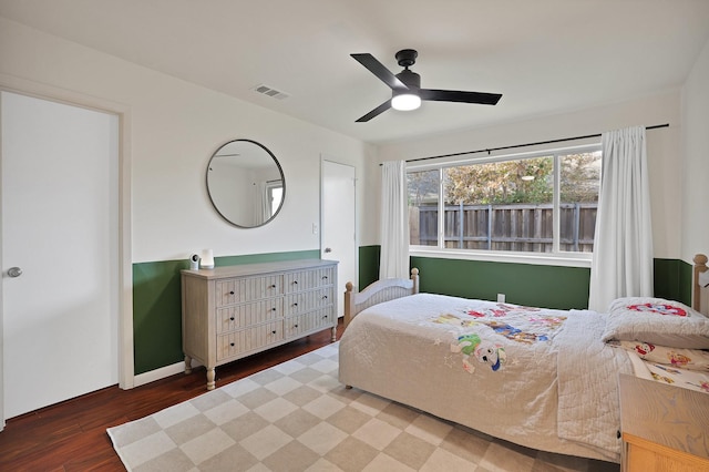 bedroom with ceiling fan and wood-type flooring