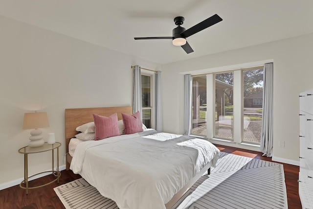 bedroom featuring ceiling fan and dark hardwood / wood-style flooring