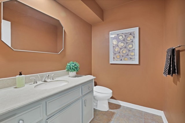 bathroom featuring tile patterned floors, vanity, and toilet