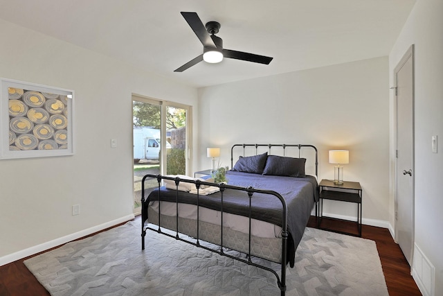 bedroom featuring ceiling fan and dark hardwood / wood-style flooring