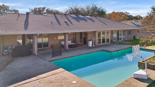 view of swimming pool featuring a patio area