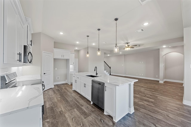 kitchen with white cabinets, sink, an island with sink, and appliances with stainless steel finishes