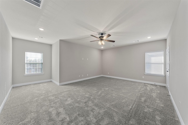 carpeted empty room with ceiling fan