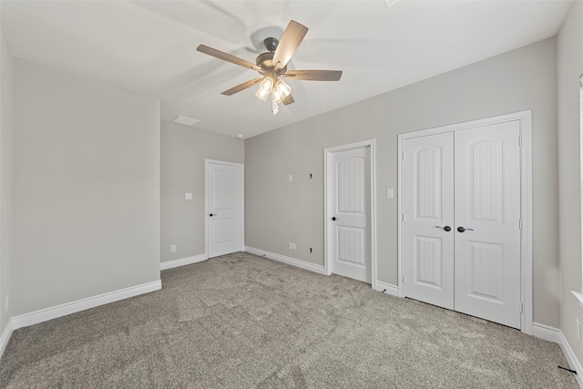 unfurnished bedroom featuring ceiling fan and light colored carpet