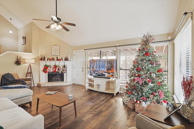 living room featuring ceiling fan, high vaulted ceiling, and dark wood-type flooring