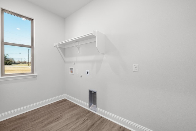 laundry area featuring washer hookup, hardwood / wood-style floors, hookup for a gas dryer, and electric dryer hookup