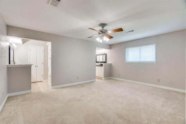 carpeted empty room with ceiling fan