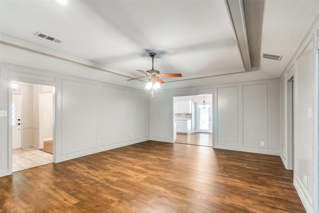 unfurnished bedroom with ensuite bathroom, light hardwood / wood-style flooring, and ceiling fan