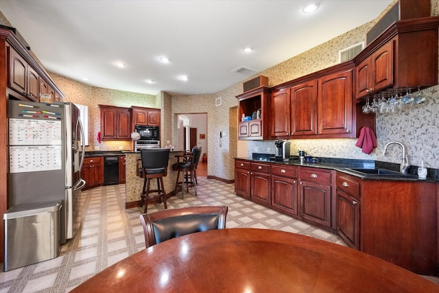 kitchen featuring black appliances and sink