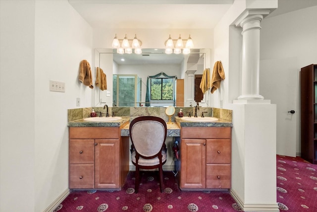 bathroom featuring vanity and a shower with shower door