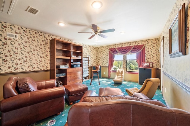 living room featuring ceiling fan and carpet floors