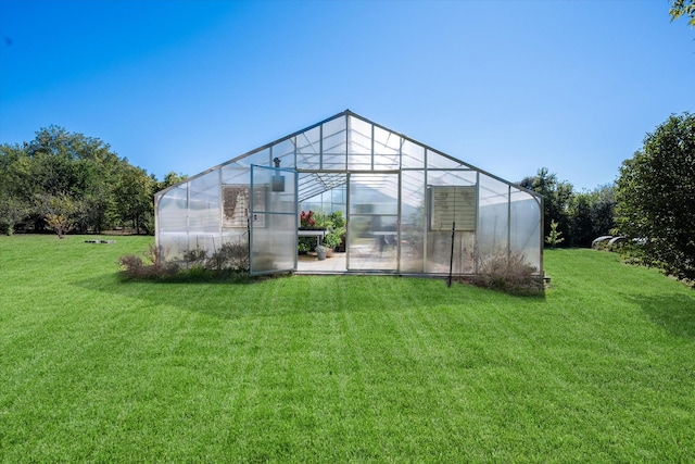 view of outdoor structure featuring a yard