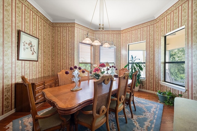 dining area featuring dark hardwood / wood-style flooring and ornamental molding