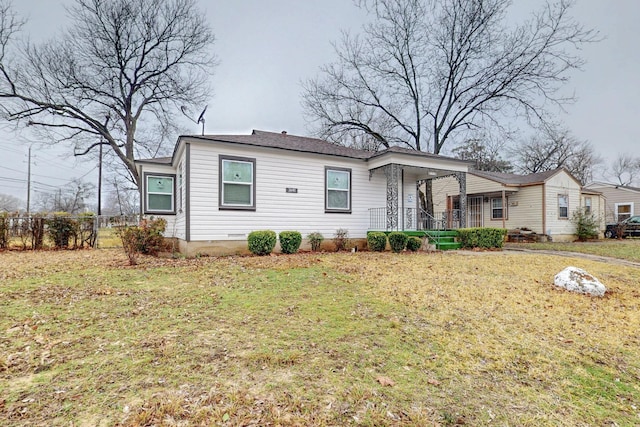 ranch-style home featuring a front yard