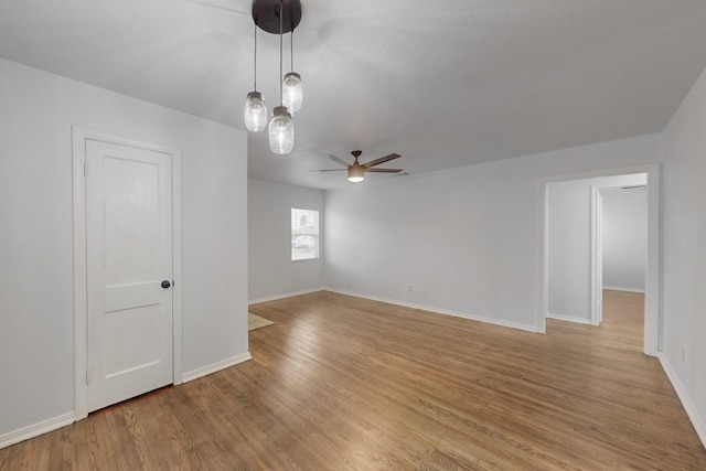 spare room featuring ceiling fan and light wood-type flooring