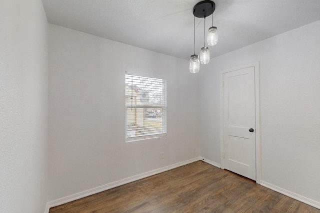 empty room featuring dark wood-type flooring